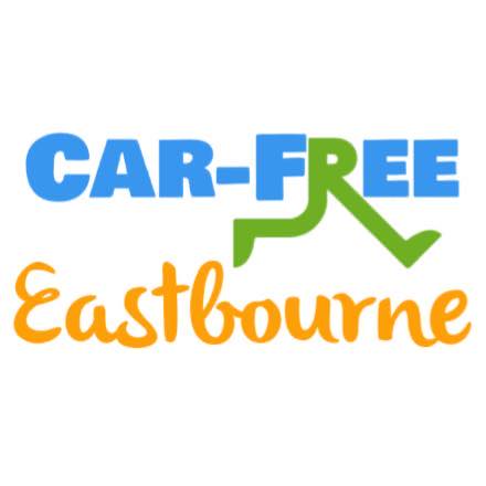 logo for car free eastbourne. shows pair of green legs walking hanging from the letter R in Free