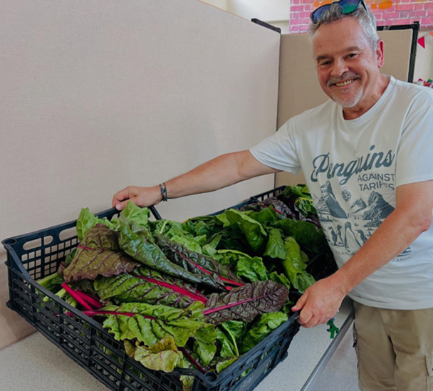 Miles Berkley with a tray full of large leaf veg
